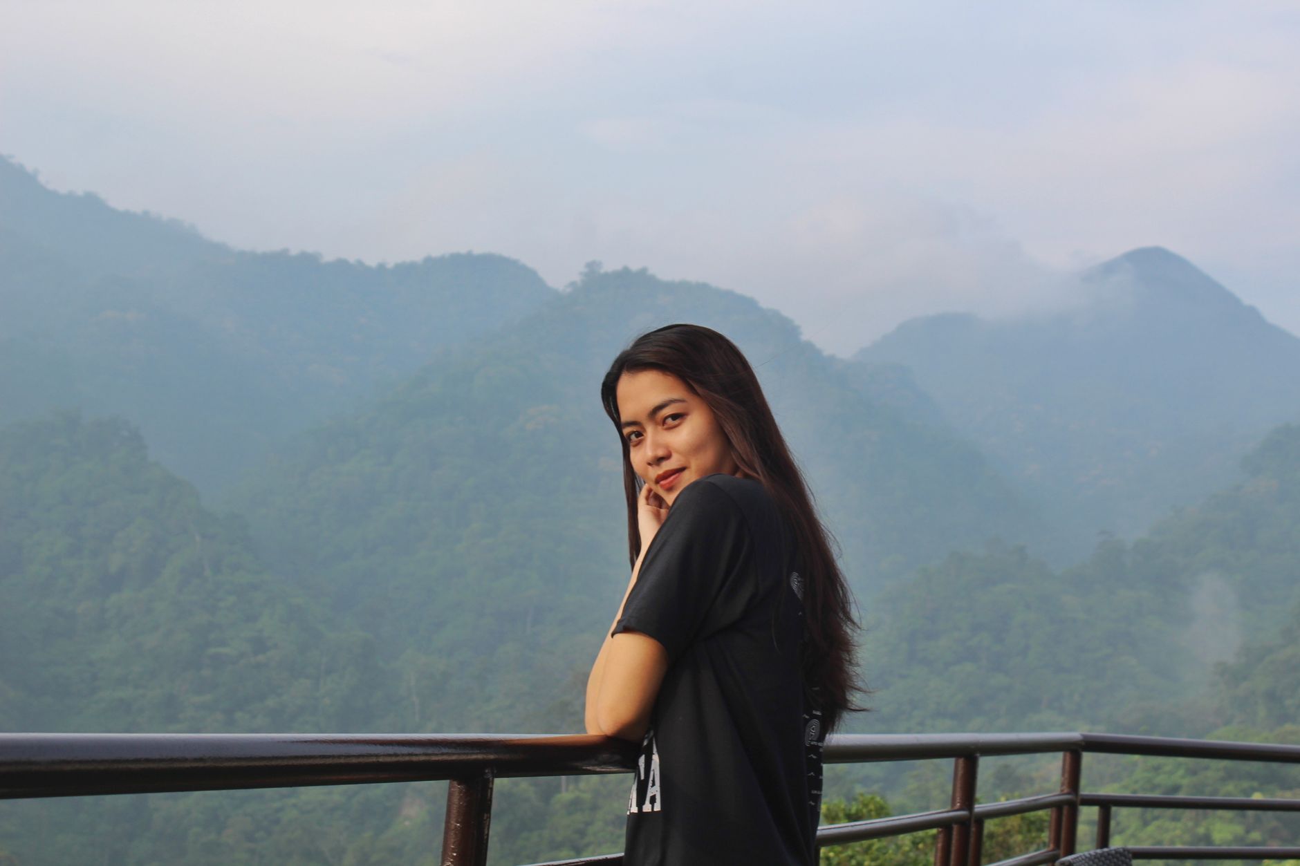 Editorial team member overlooking alpine valley